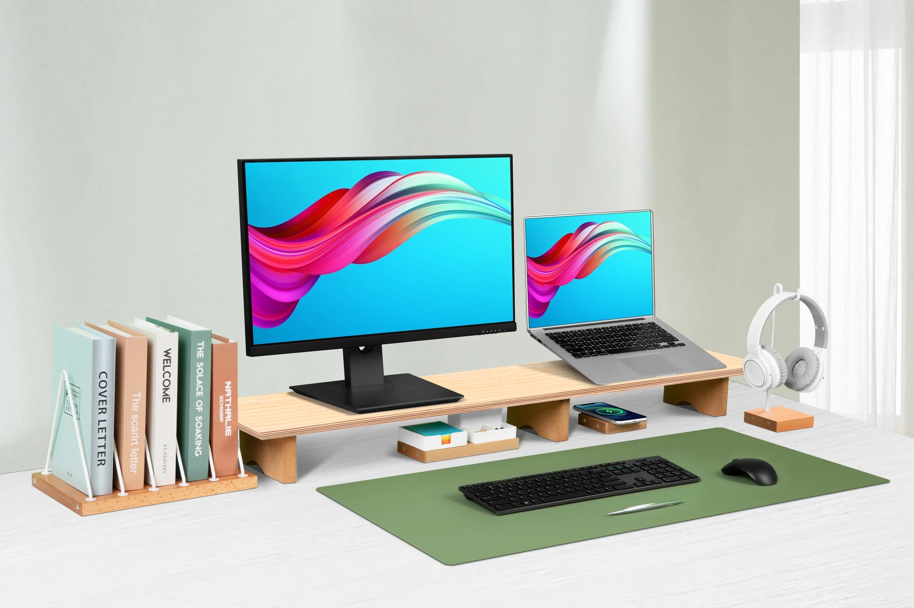 the oak monitor stand with a monitor and laptop on it
