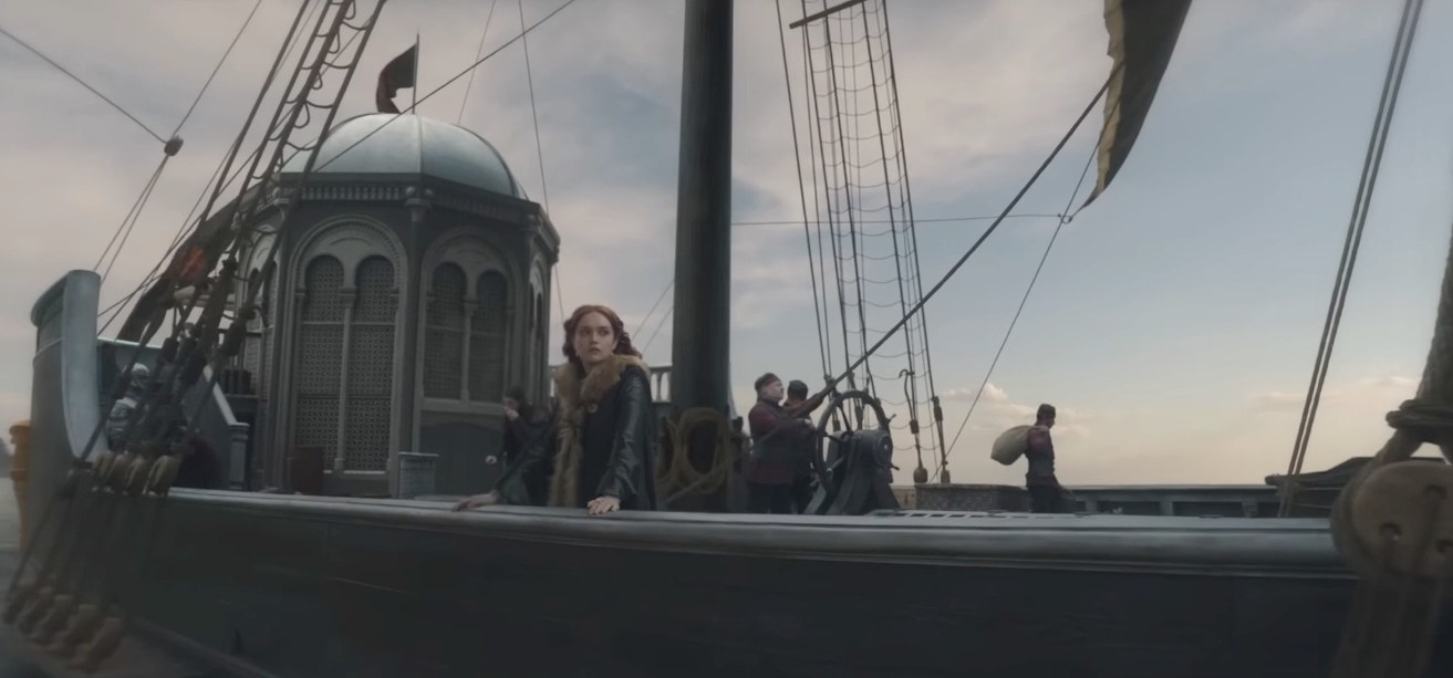 Alicent stands near the edge of a ship, Larys can be seen in the background