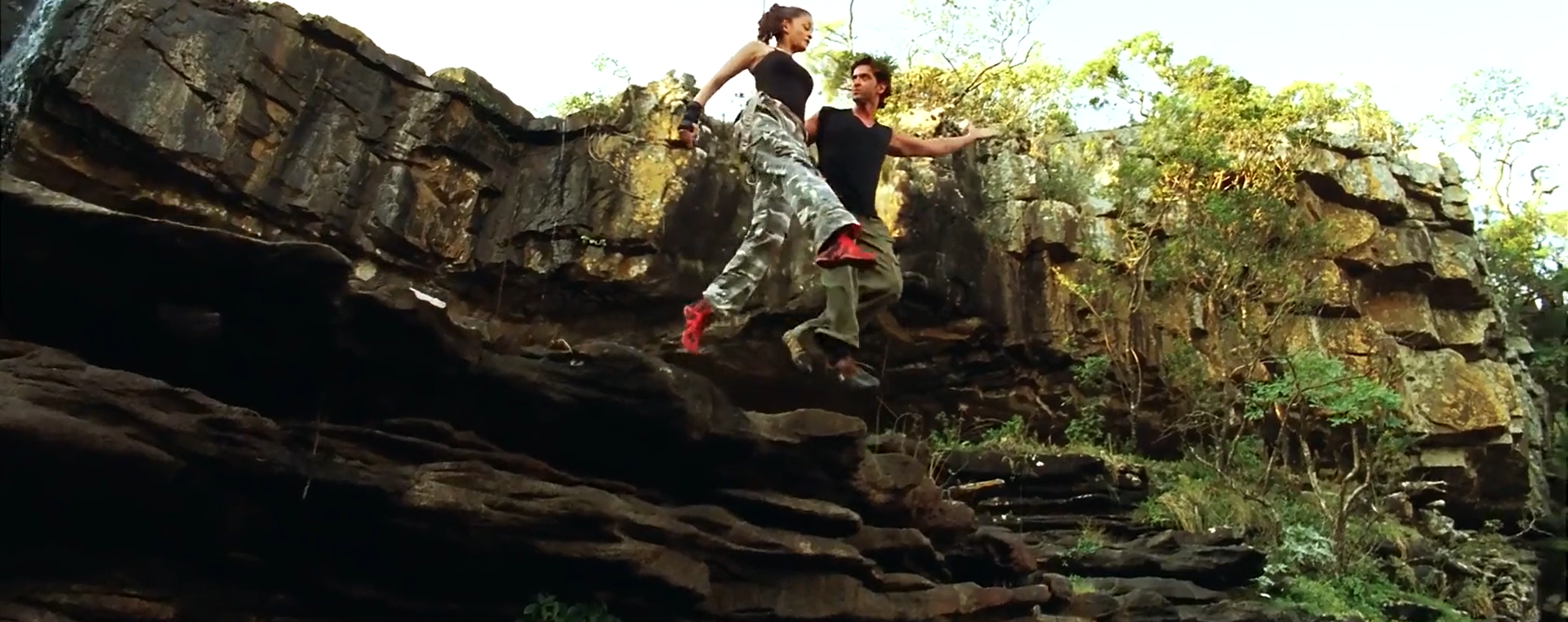 Aishwarya Rai and Hrithik Roshan jumping off a cliff while looking at each other