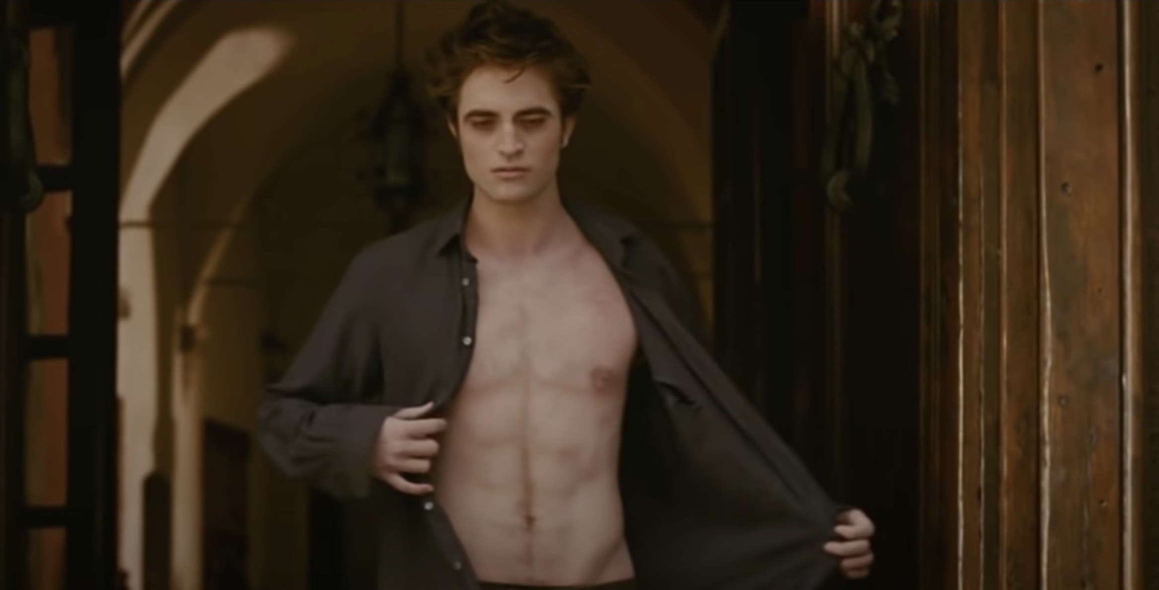 Edward walking towards the sun shirtless