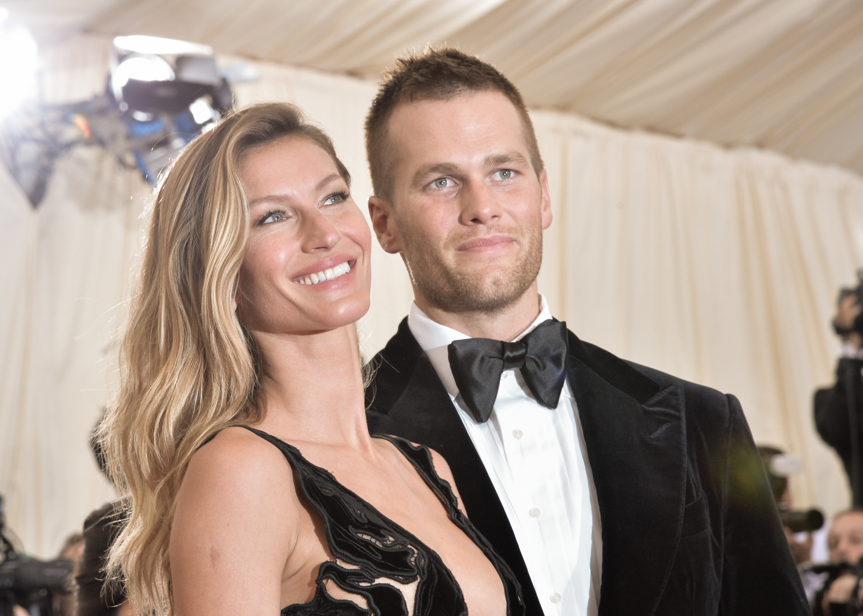 New England Patriots quarterback Tom Brady, left, and girlfriend, model  Giselle Bundchen sit courtside in the first half of Game 2 of the NBA  Eastern Conference basketball finals between the Boston Celtics