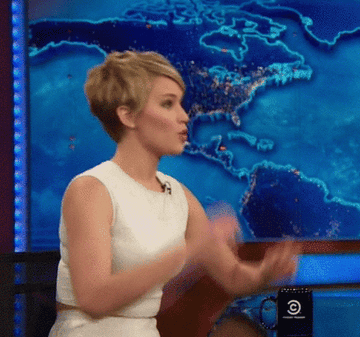 Jennifer Lawrence gestures to indicate that her mind has been blown as a result of something she&#x27;s heard while on &quot;The Daily Show with Jon Stewart&quot;