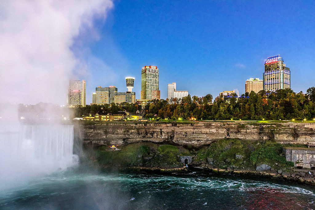 view of city skyline and waterfall