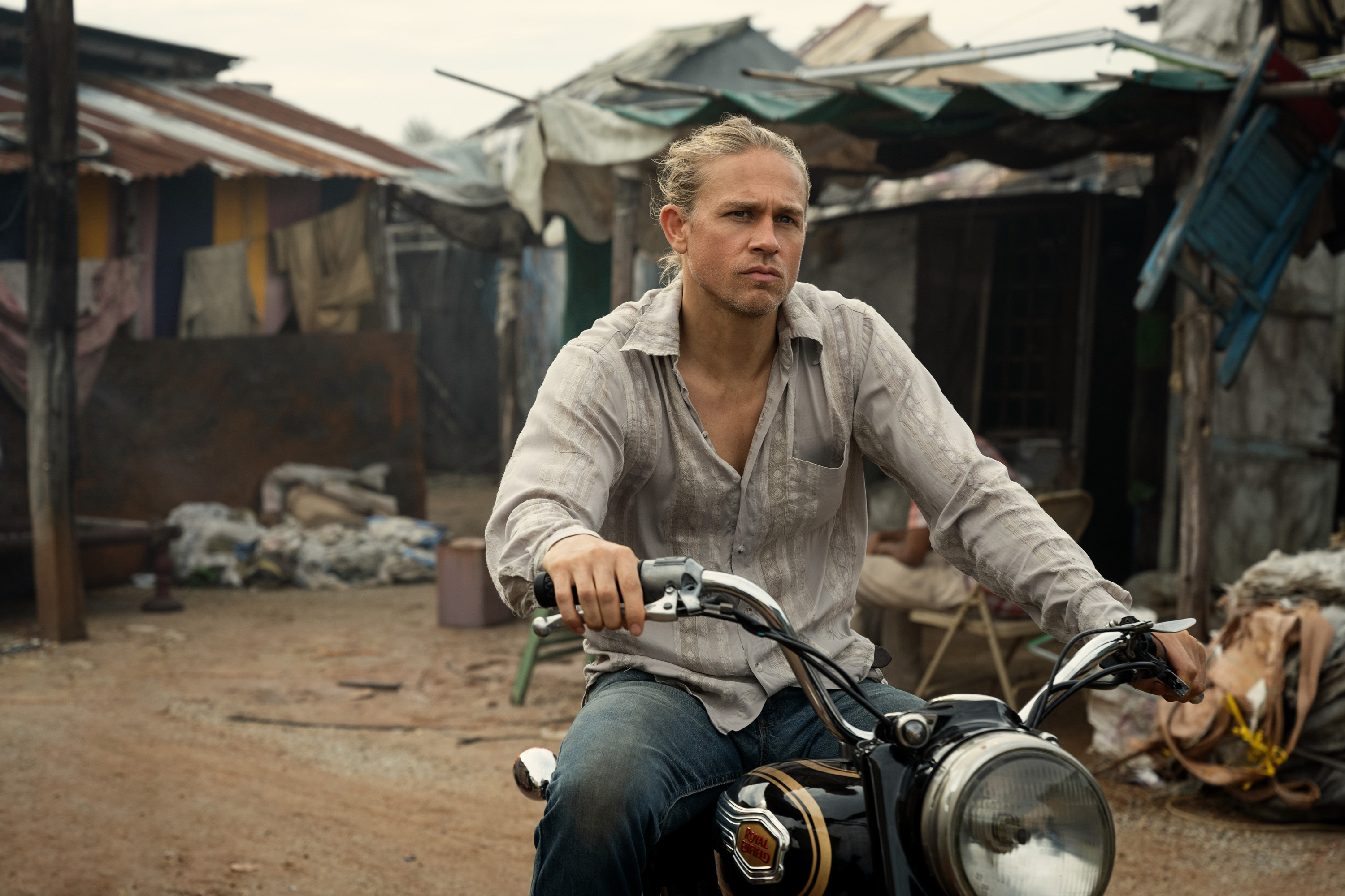 Charlie Hunnam on a motorcycle