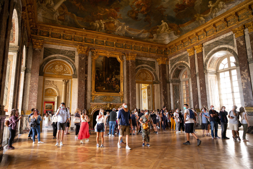 Tourists inside the Palace of Versailles