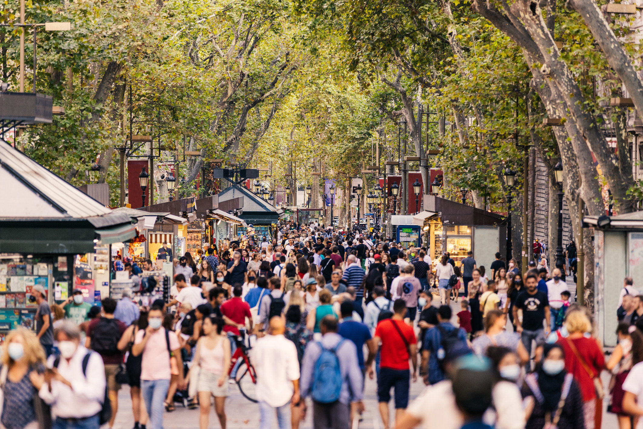 Crowds of tourists walking on Las Ramblas in Barcelona