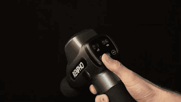 A person adjusting the speed on the massage gun