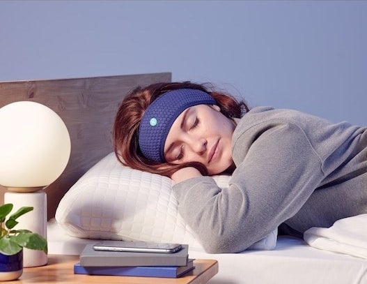 a person sleeping while wearing the audio headband