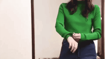 woman adjusting the sleeves to her sweater