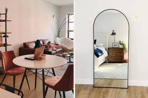 A mid-century modern dining table on the left and an arched standing wall mirror on the right