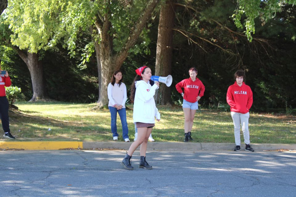 A student activist speaks with a megaphone