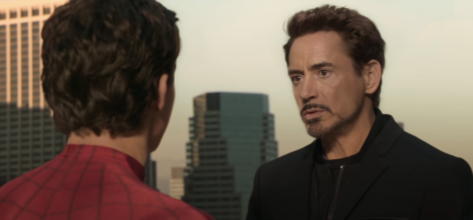 close up of Tony Stark talking to Spider-Man