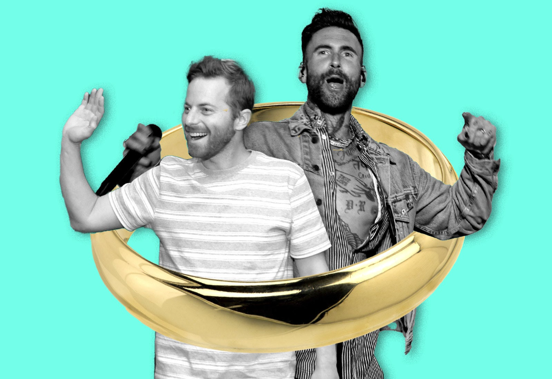 Encircled inside a giant gold wedding ring, Ned Fulmer and Adam Levine wave and cheer