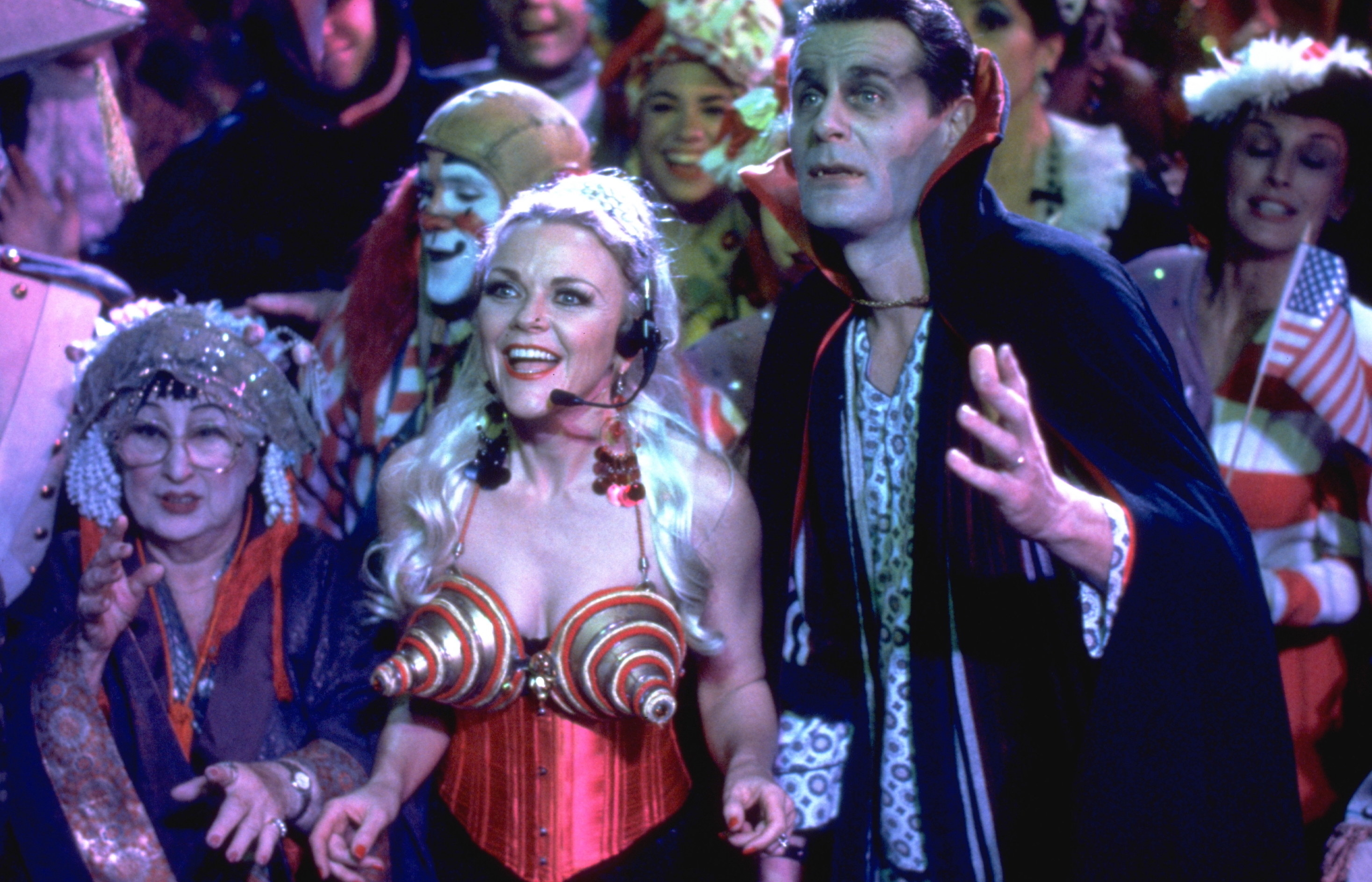 people dressed in costumes in the party scene