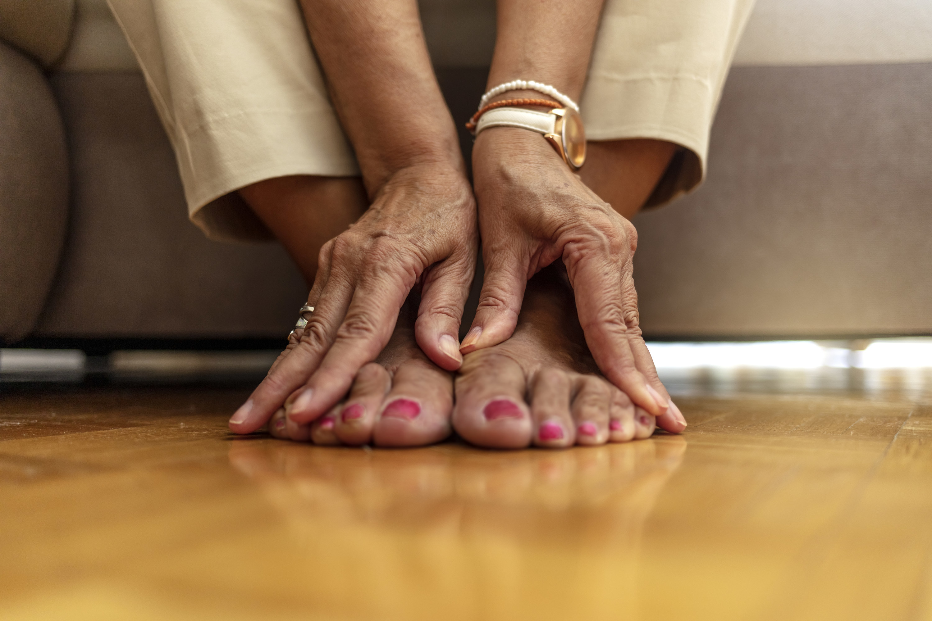 a woman touching her feet
