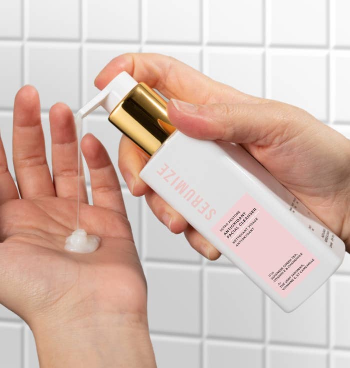 a person pumping the cleanser into their palm