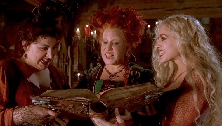 the three witches of hocus pocus looking at their book