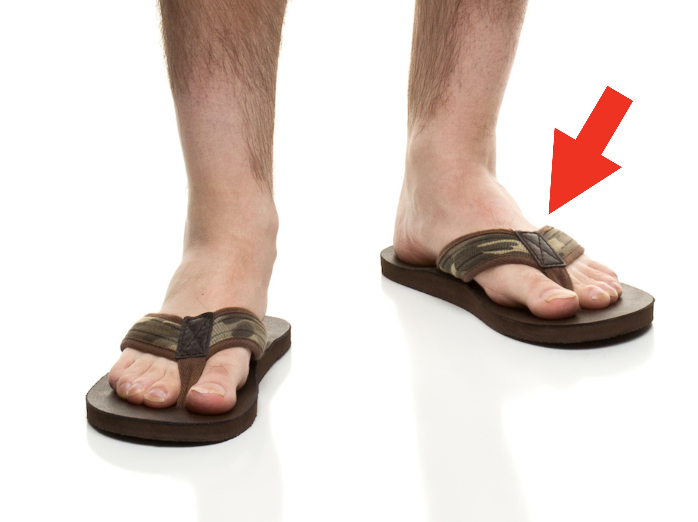 Someone wearing leather flip-flops