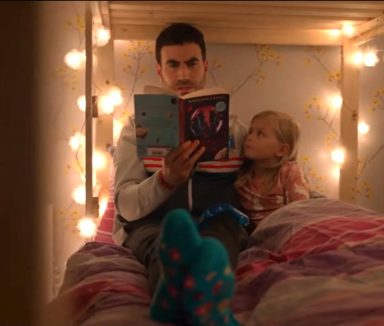 brett goldstein as roy kent reads a bedtime story in &quot;ted lasso&quot;