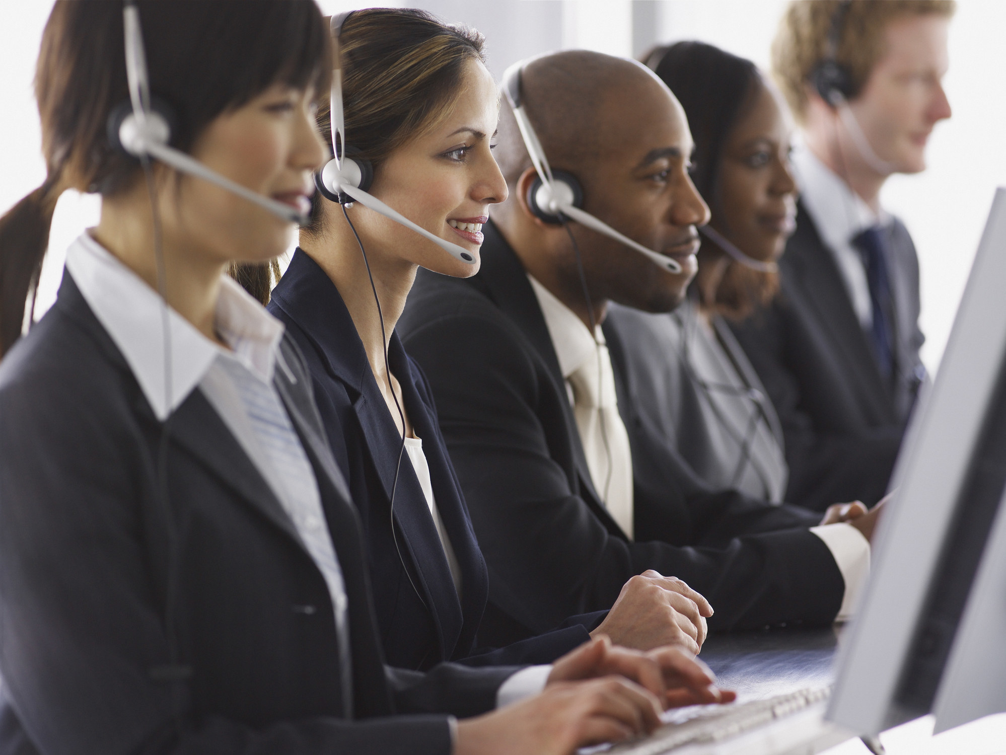 row of customer care people on the phone