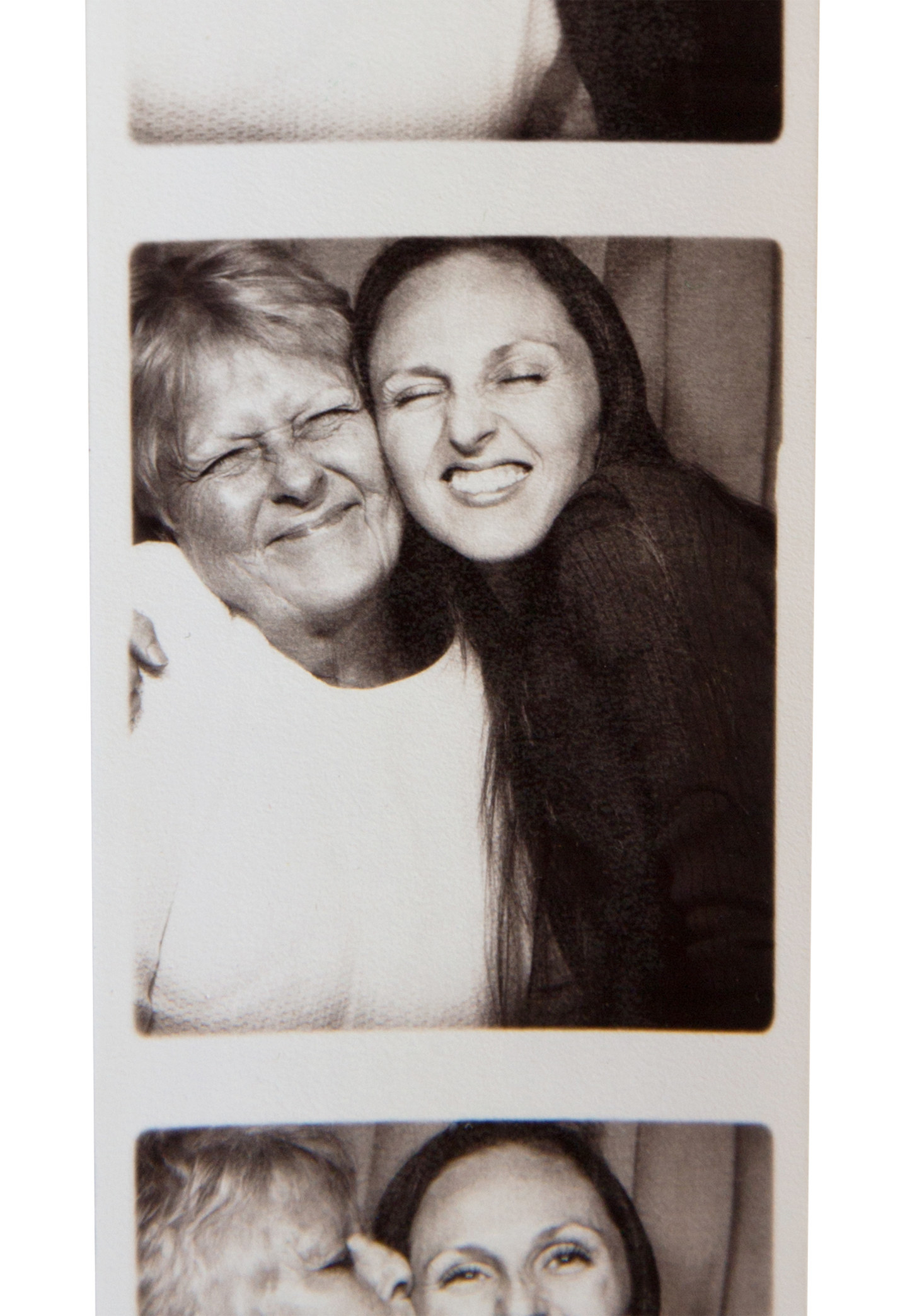 Photobooth strip photo of a mother and daughter hugging
