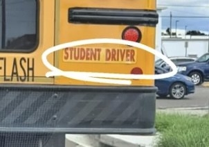 A student driver sticker on a school bus