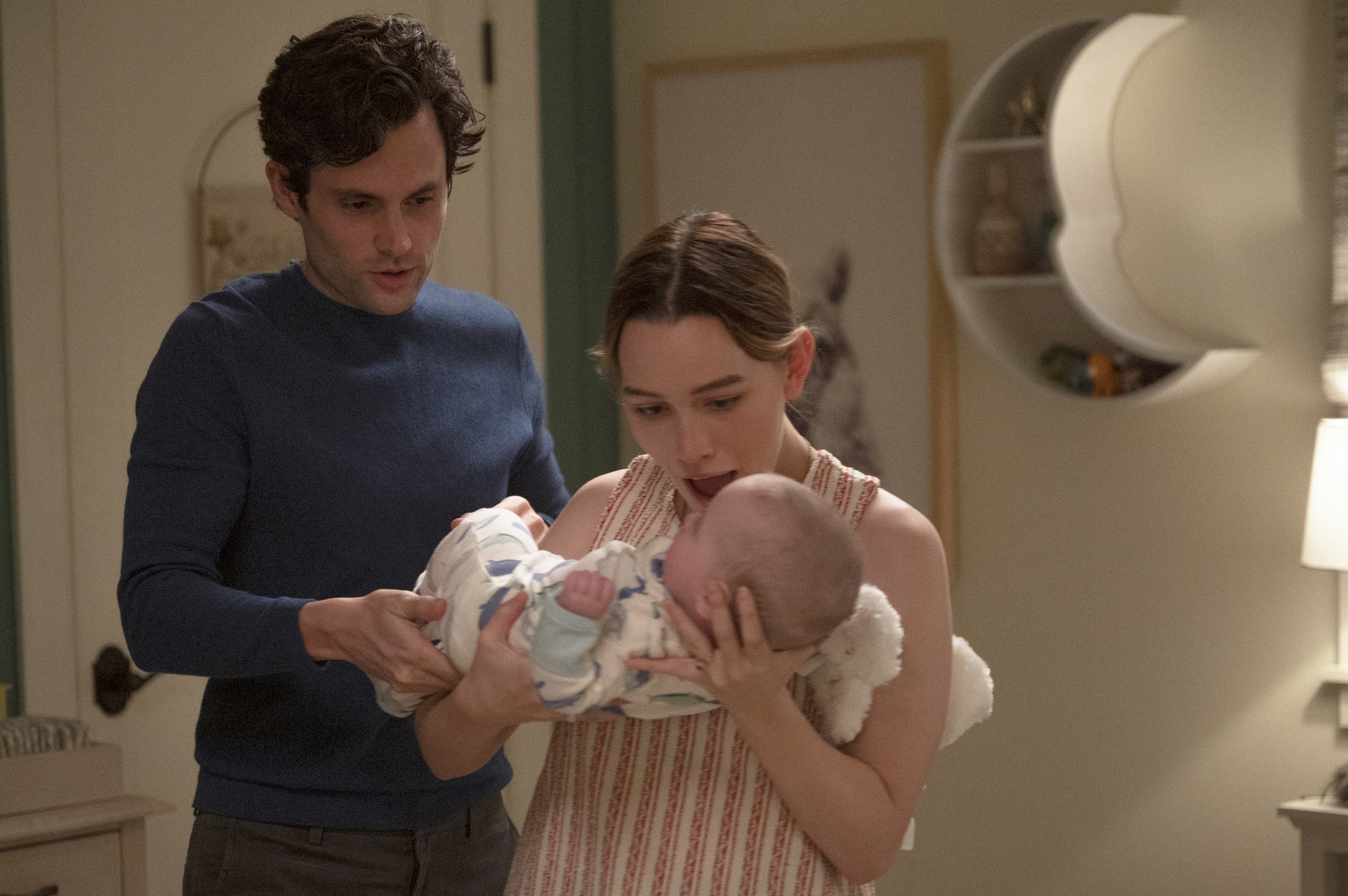 the two characters with their baby