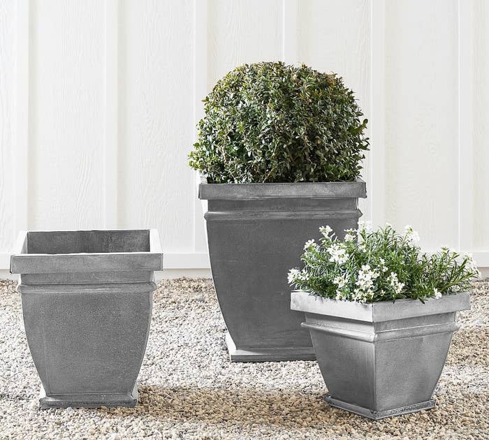 three outdoor planters