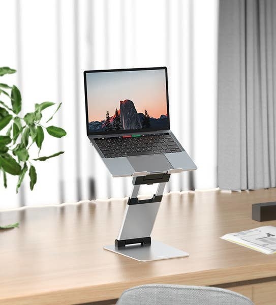the laptop stand holding a laptop
