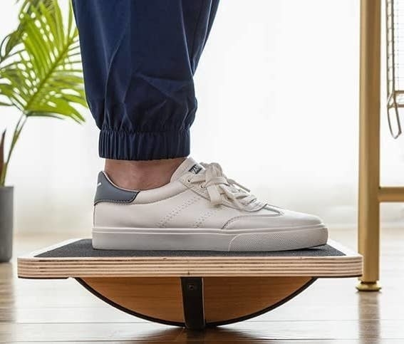 a person standing on the balance board