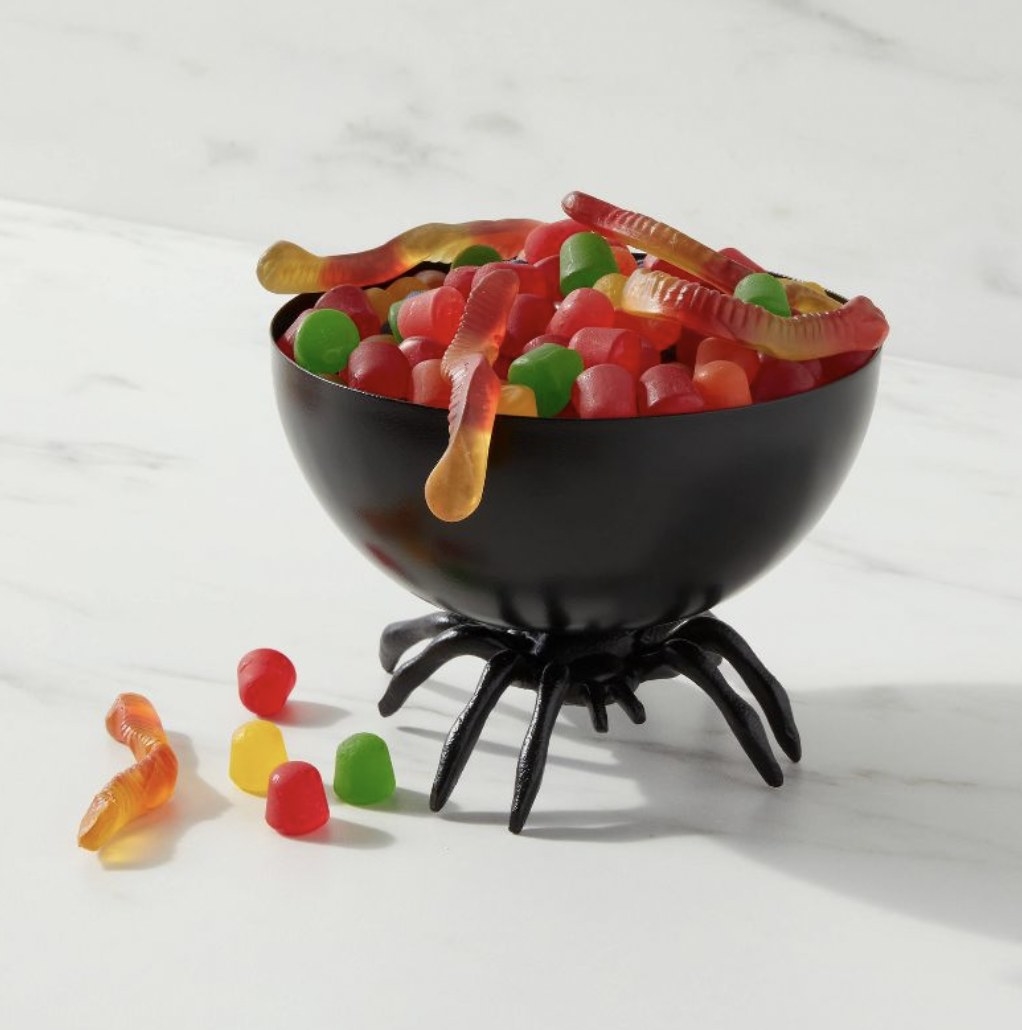 The spider bowl overflowing with candy gummy worms and gumdrops