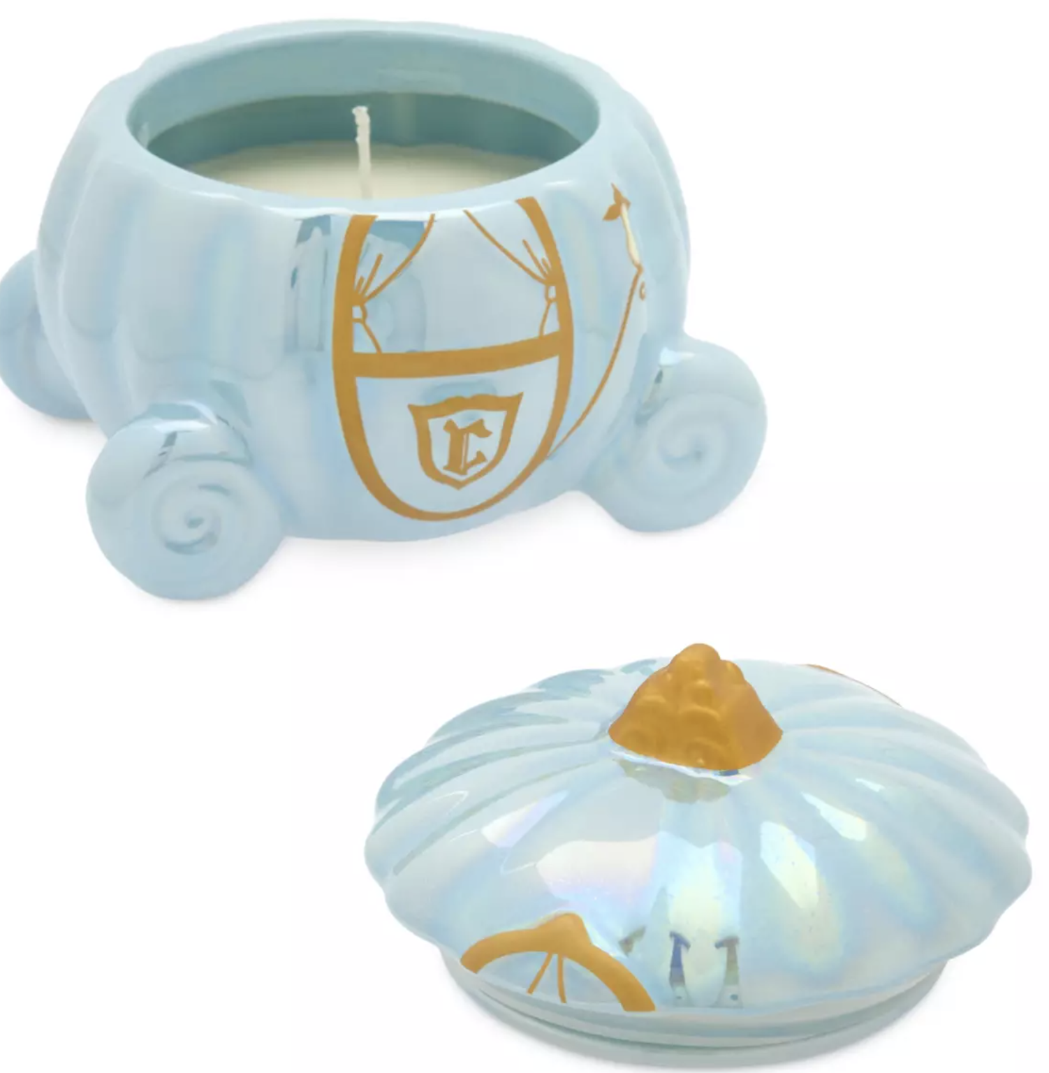 A Cinderella pumpkin candle with a lid