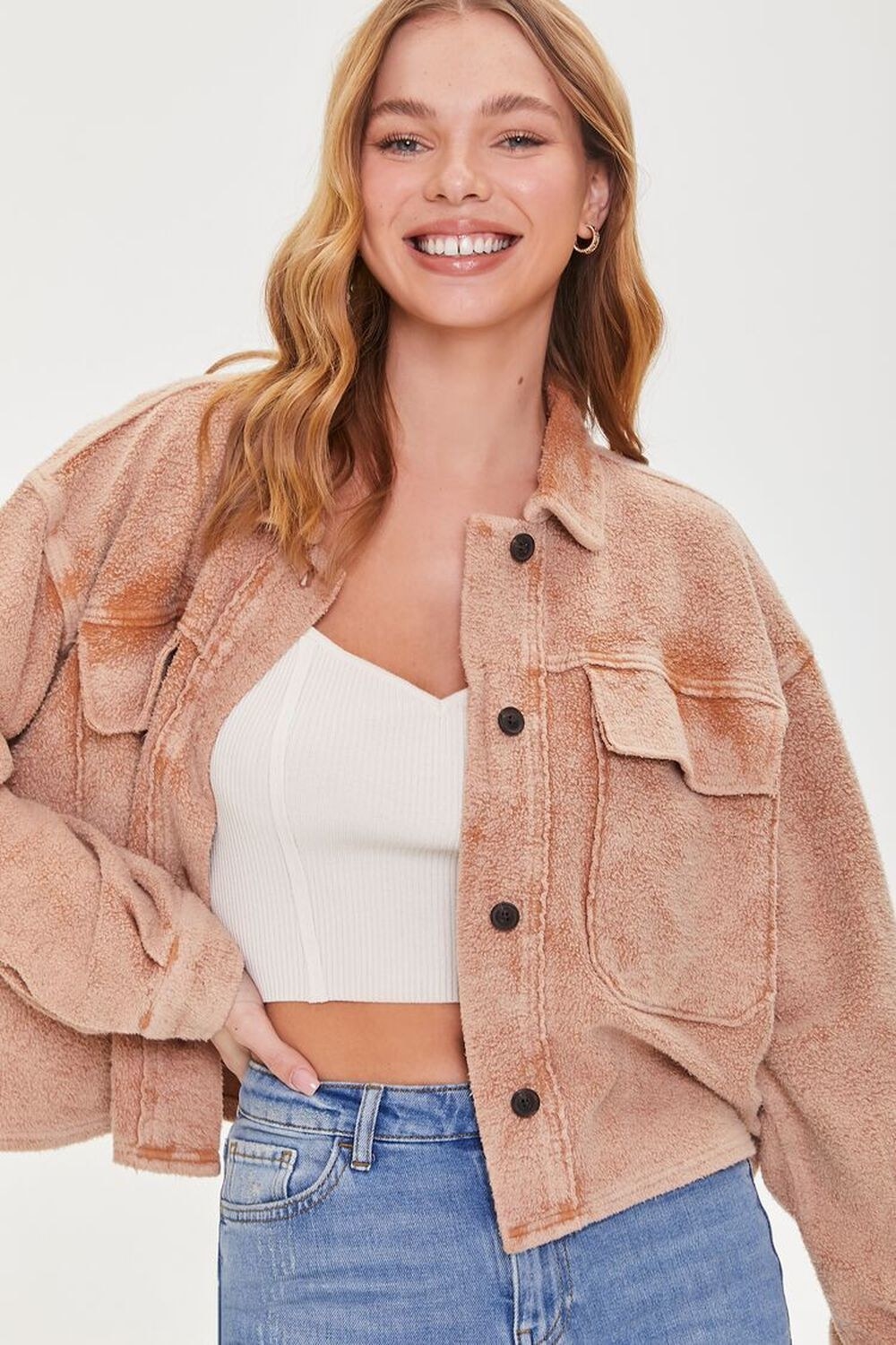 Model wearing the fleece jacket in light brown
