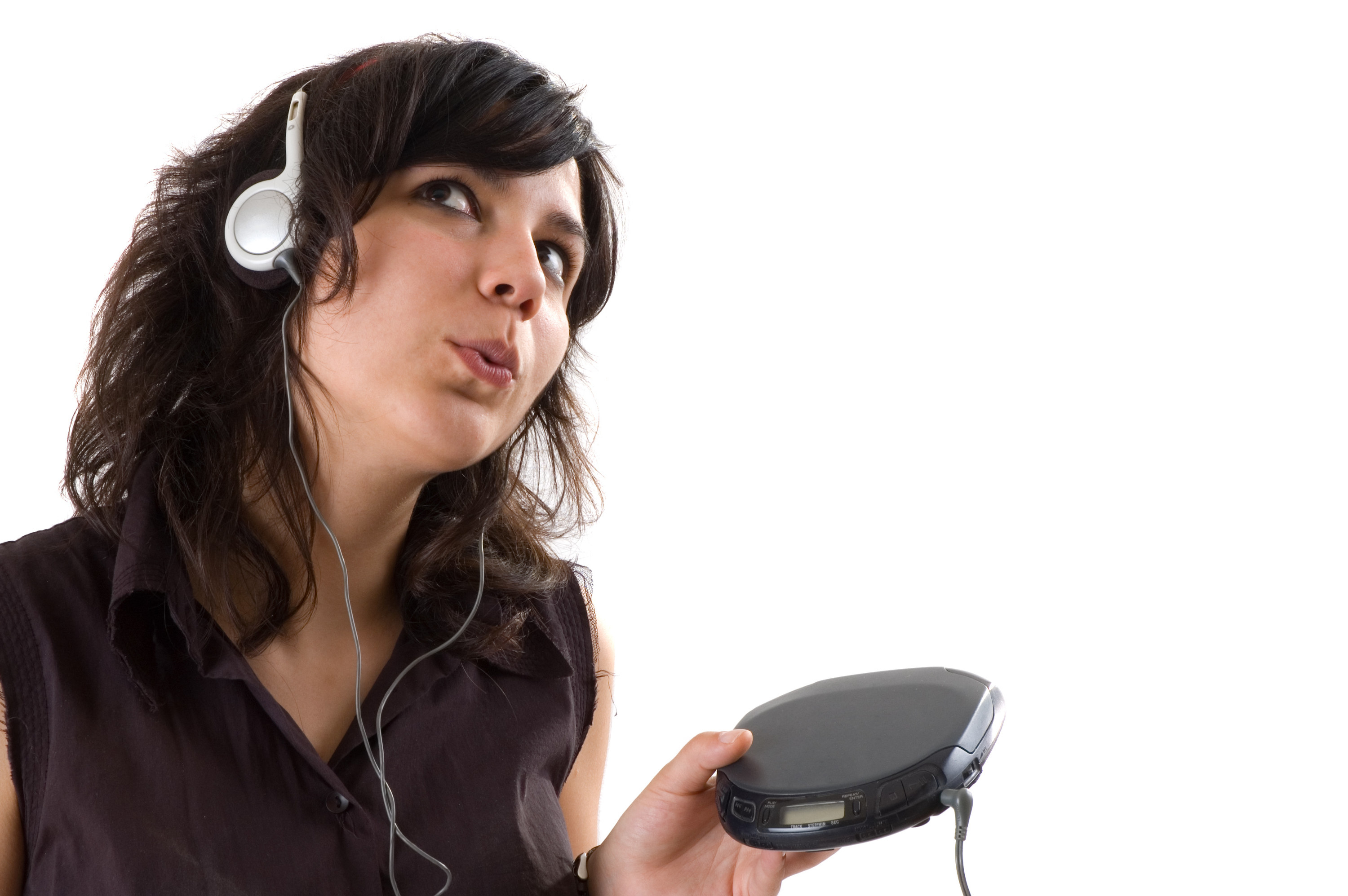 a girl listening to music through her Discman