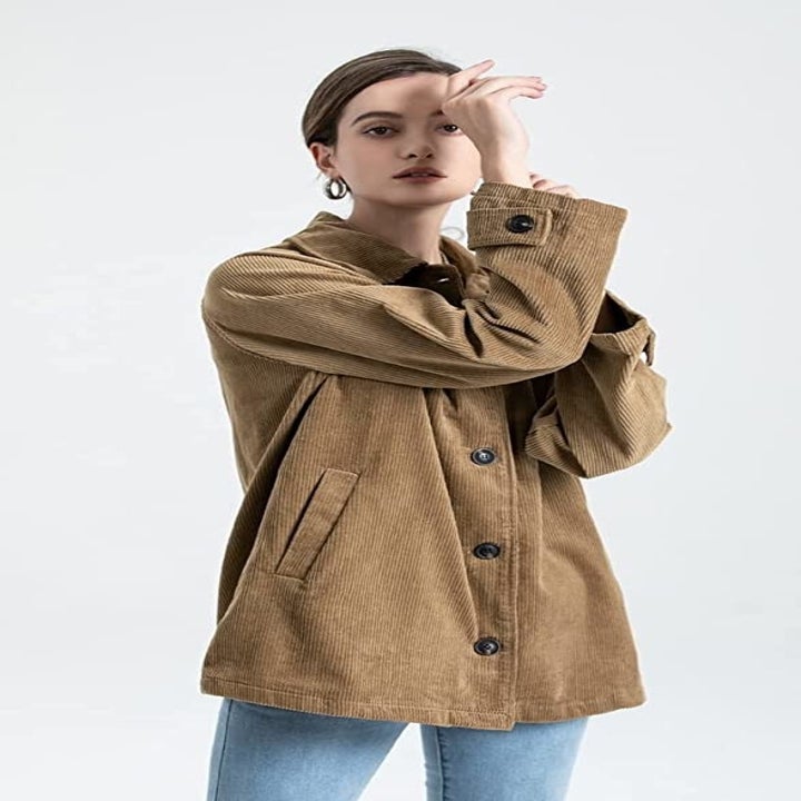 Model in the brown coat buttoned-up