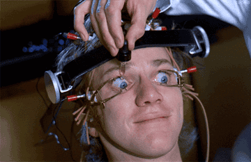 In a scene from A Clockwork Orange, a man has his eyes clamped open and has eye drops applied