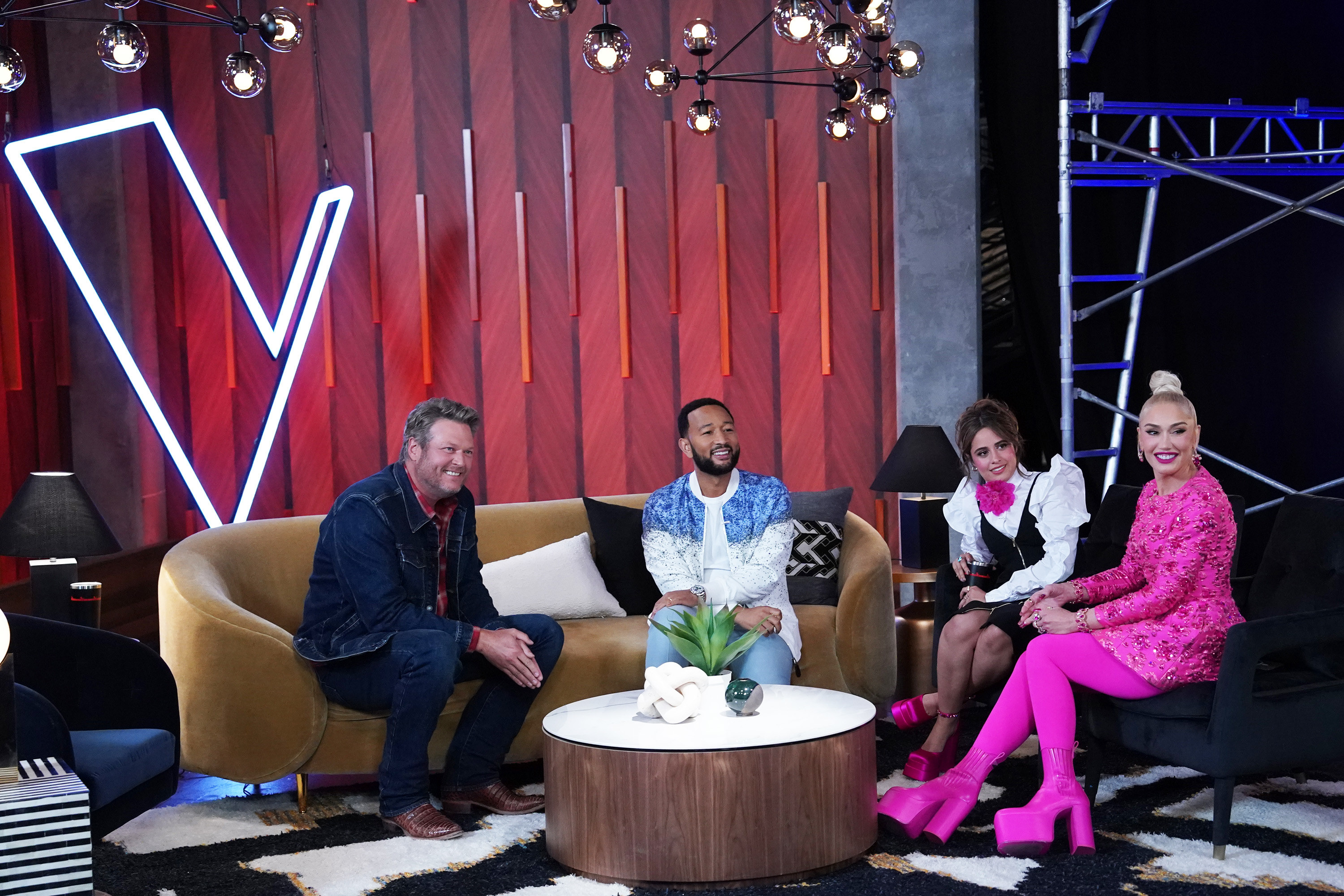 The Voice judges sitting on couches together