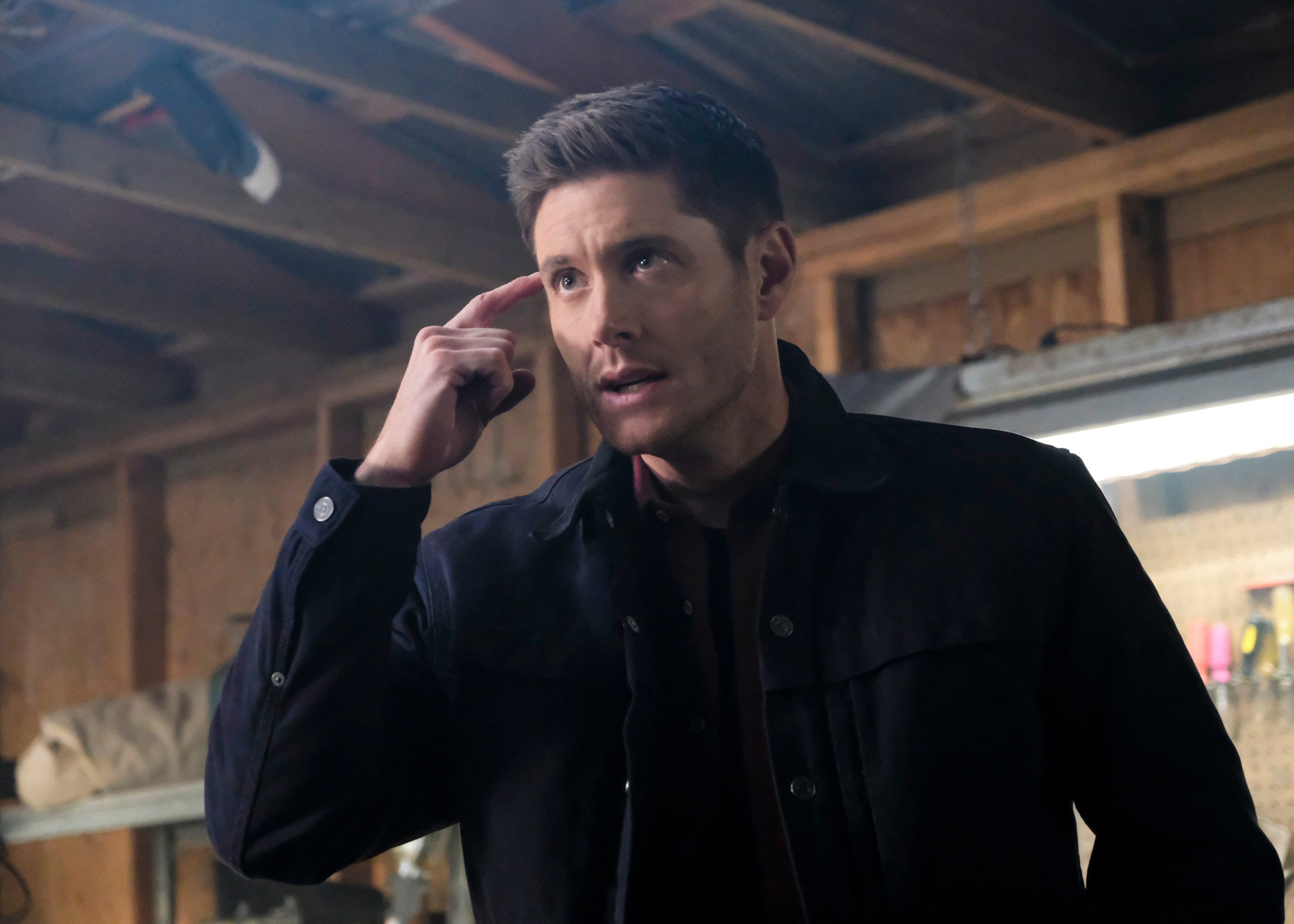 Dean pointing to his head