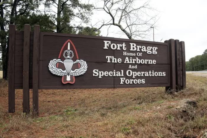 a wooden sign in a grassy area that reads, fort bragg, home of the airborne and special operations forces