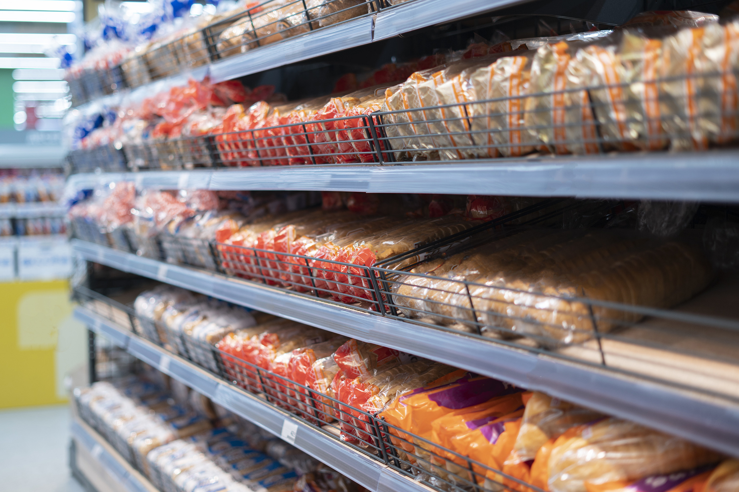 Loaves of bread on grocery store shelves