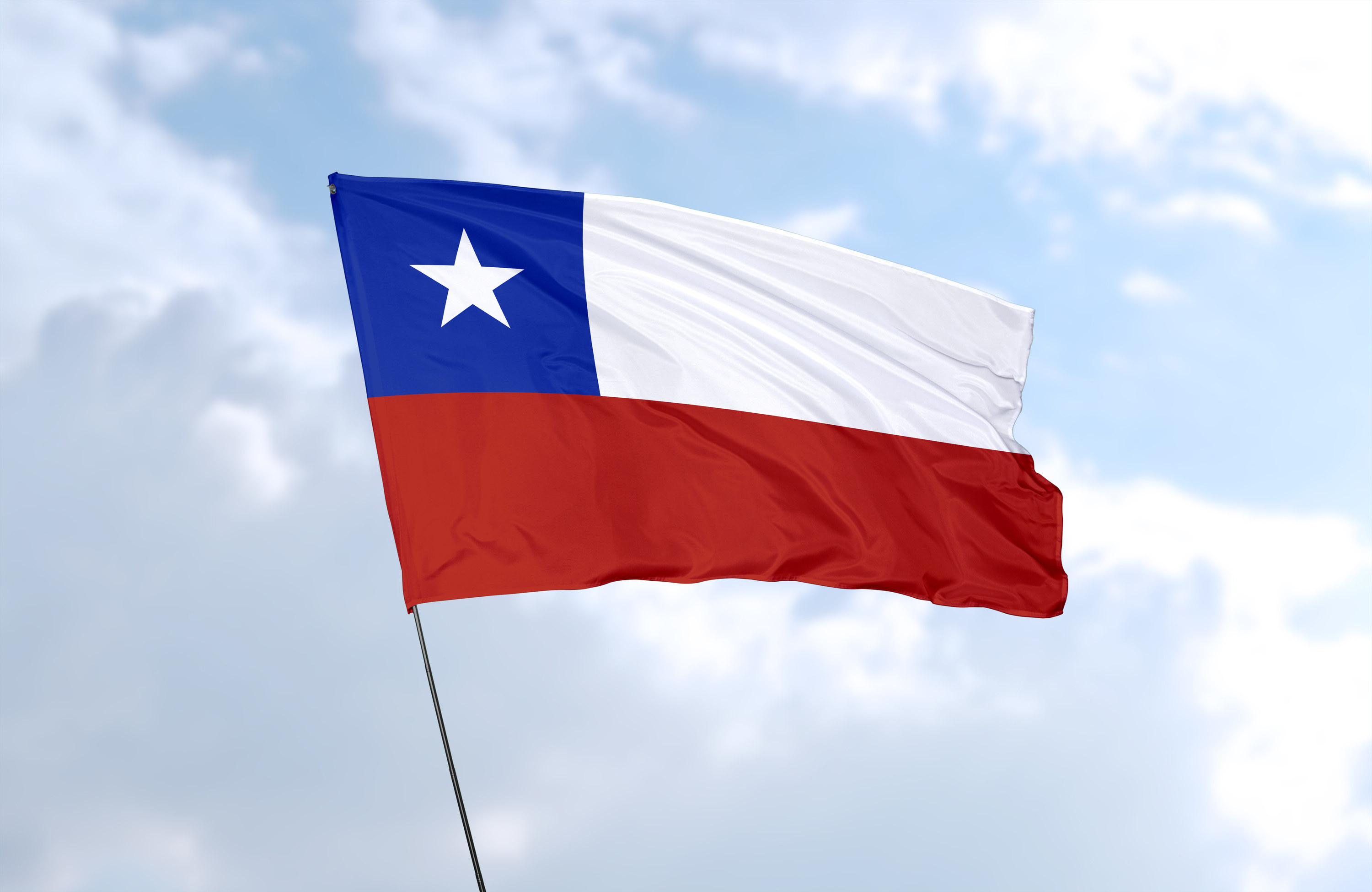 Flag of Chile, with a horizontal white stripe over a red stripe; a dark blue canton with a large white star in the upper hoist corner