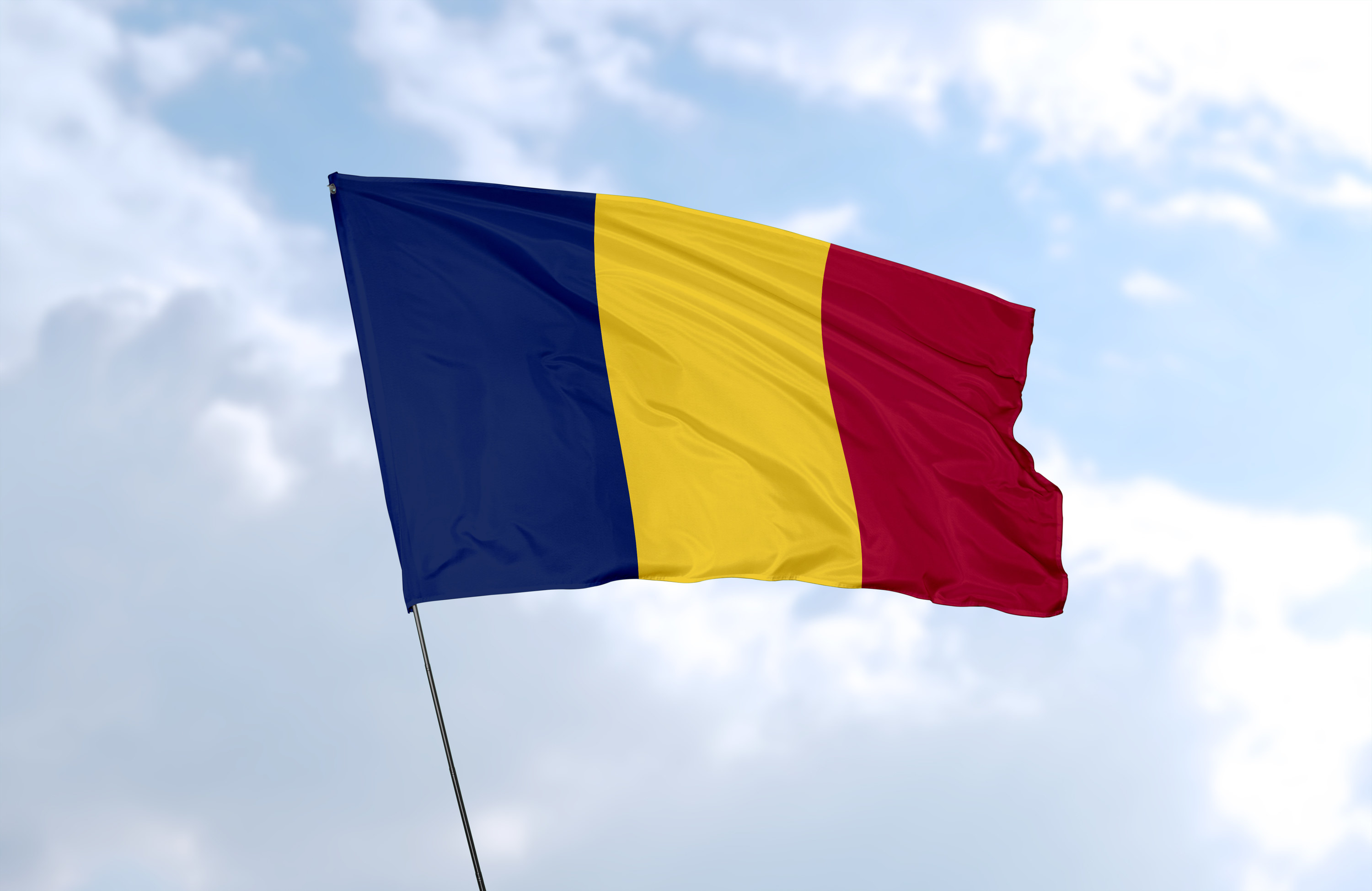 Flag of Chad, a vertical tricolor consisting of a blue, gold, and red field