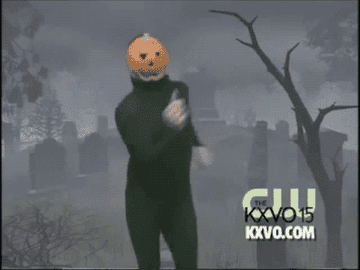 man dancing with pumpkin head