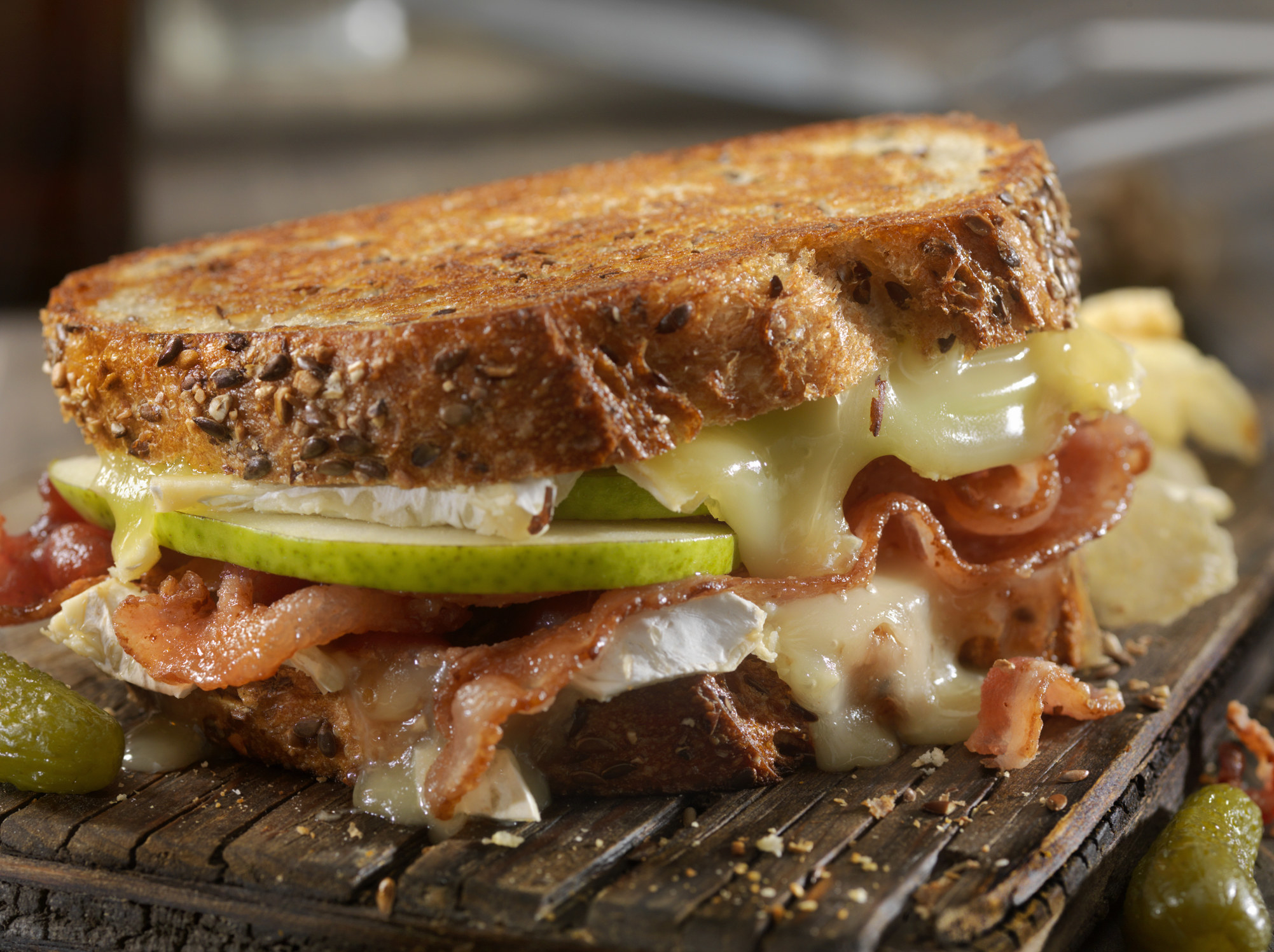 A fancy grilled cheese with apple and bacon