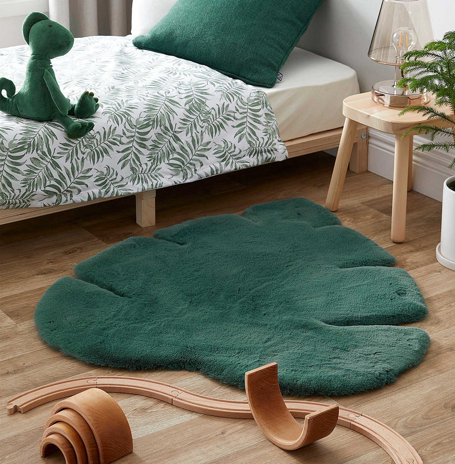The monstera rug on the floor of a bedroom