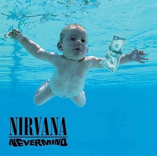 Cover of Nirvana&#x27;s Nevermind showing a naked baby swimming next to a dollar bill