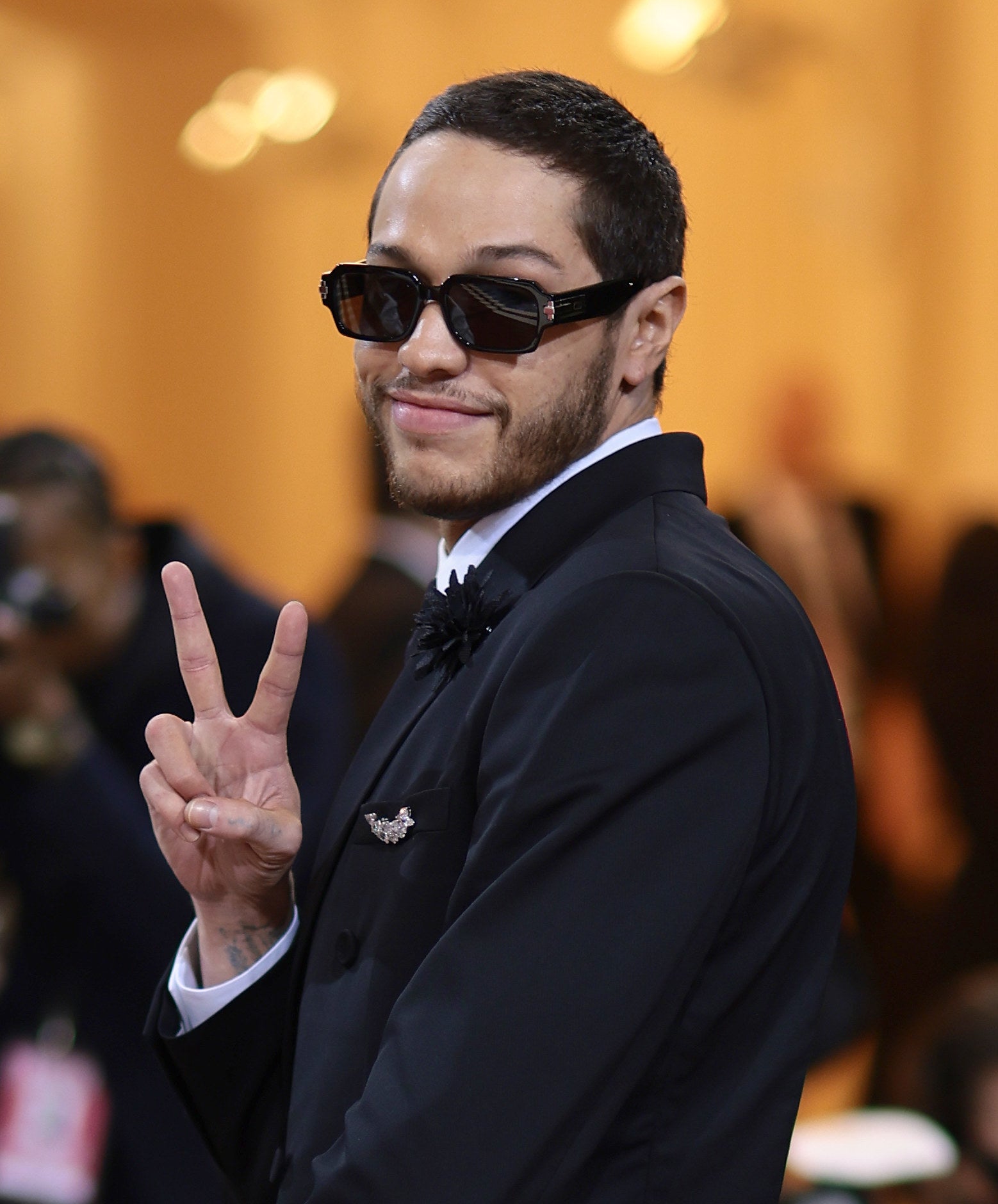 Pete giving the peace sign and wearing sunglasses