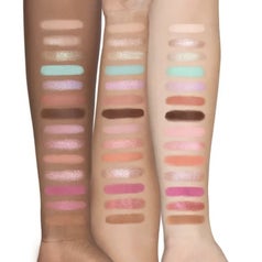 The palette shades on arms of three different skin colors (darker, mid, and lighter)