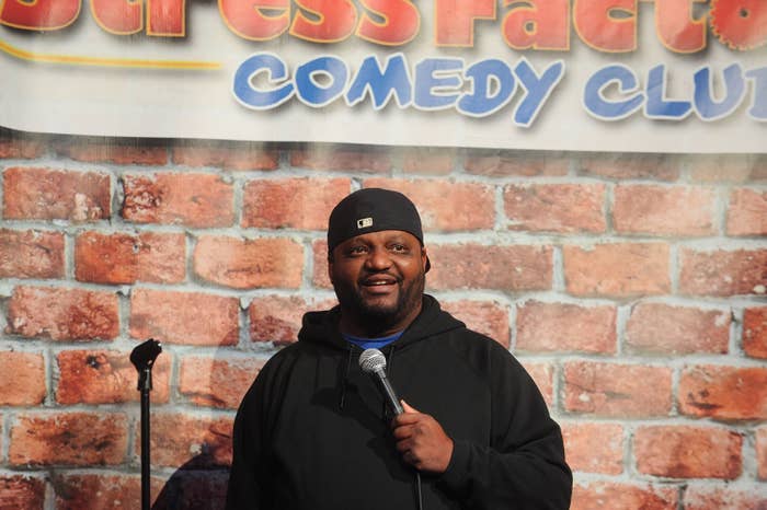 Aries Spears performing at a comedy club