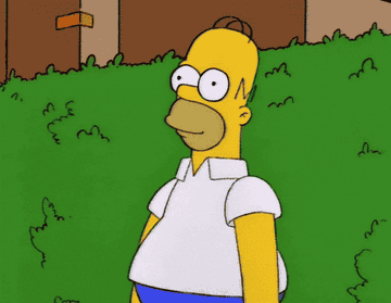 Gif de Homero Simpson escondiéndose en el arbol